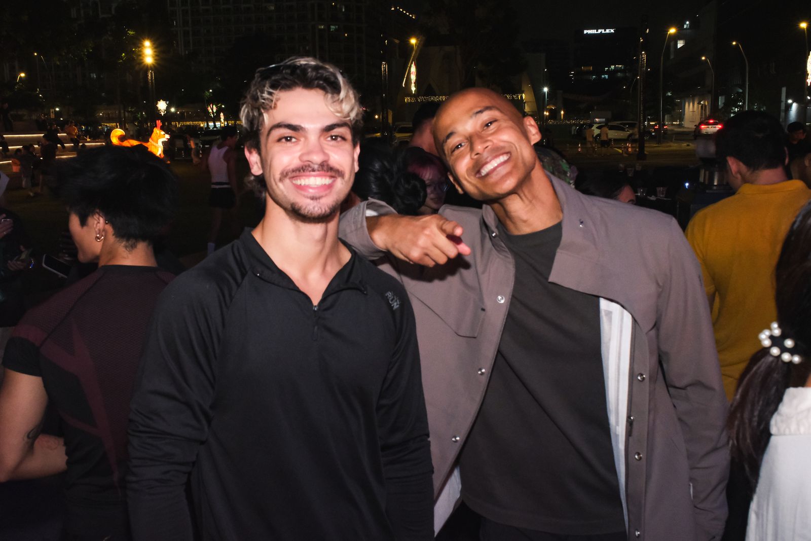 Two friends pose at the launch